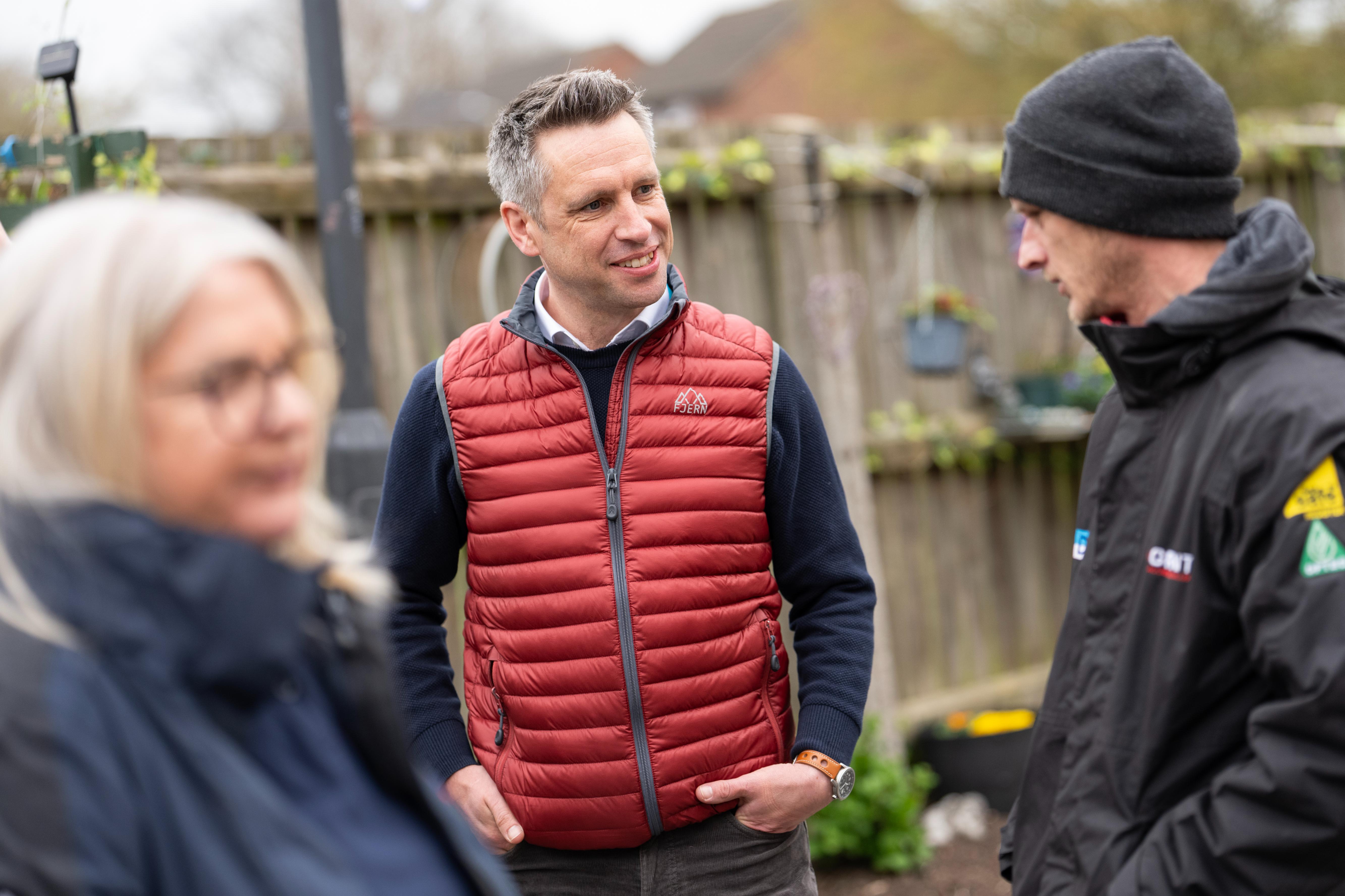 3 people feature; an out of focus lady on the left and 2 men in the centre and right.