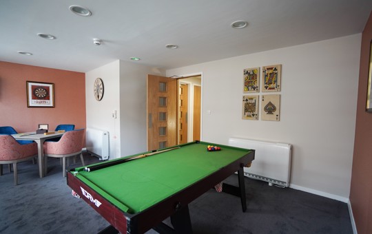 A pool table at Herald Court in a communal room